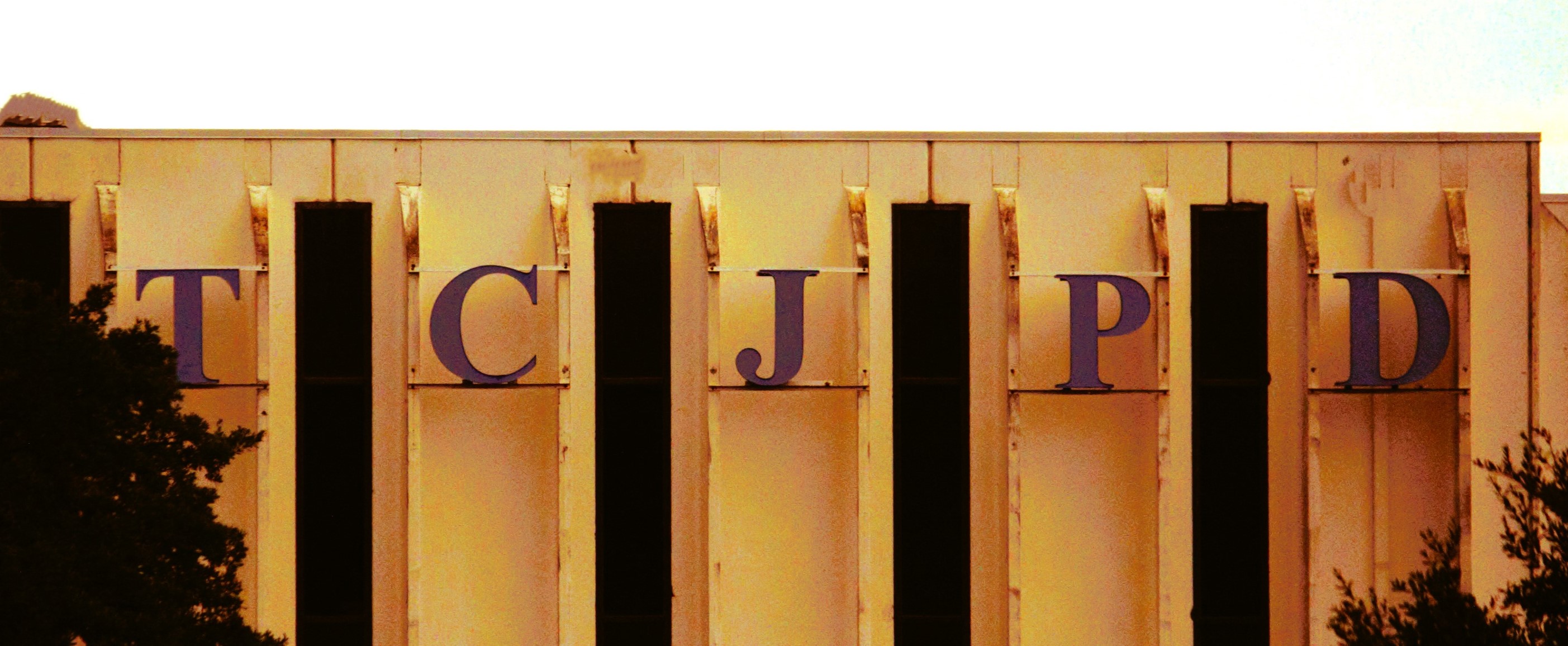 Letters TCJPD on the Travis County TASBO building